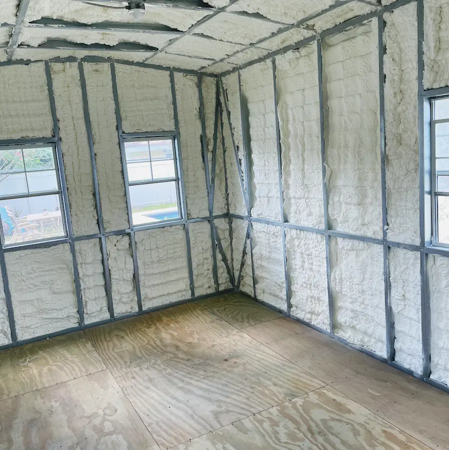 Closed-cell spray foam insulation applied to wall cavities in a residential project in Ira